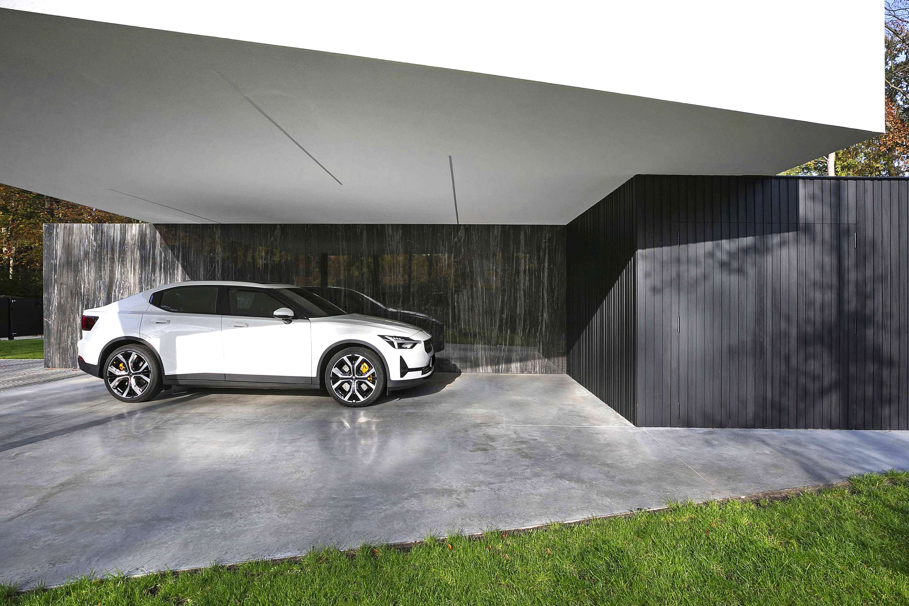 Polestar carport natuursteenwand hedendaagse architectuur icoon architecten brasschaat